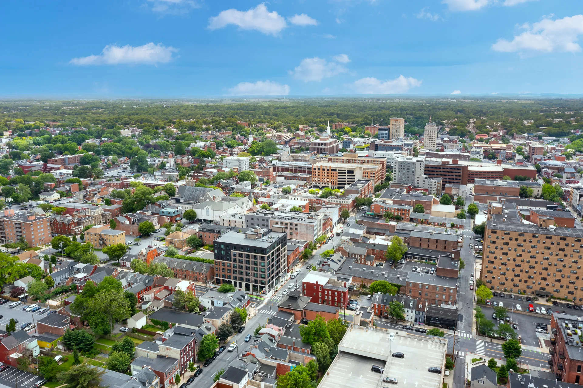 Aerial view across Lancaster City’s closely connected streets, rooftops and downtown skyline