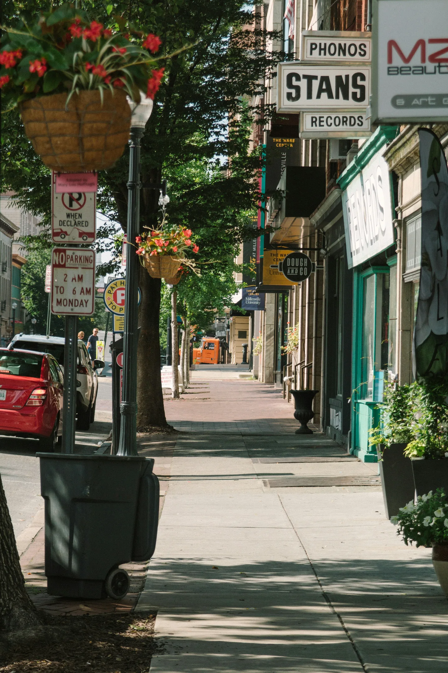 Downtown Lancaster sidewalk lined with shops and storefronts