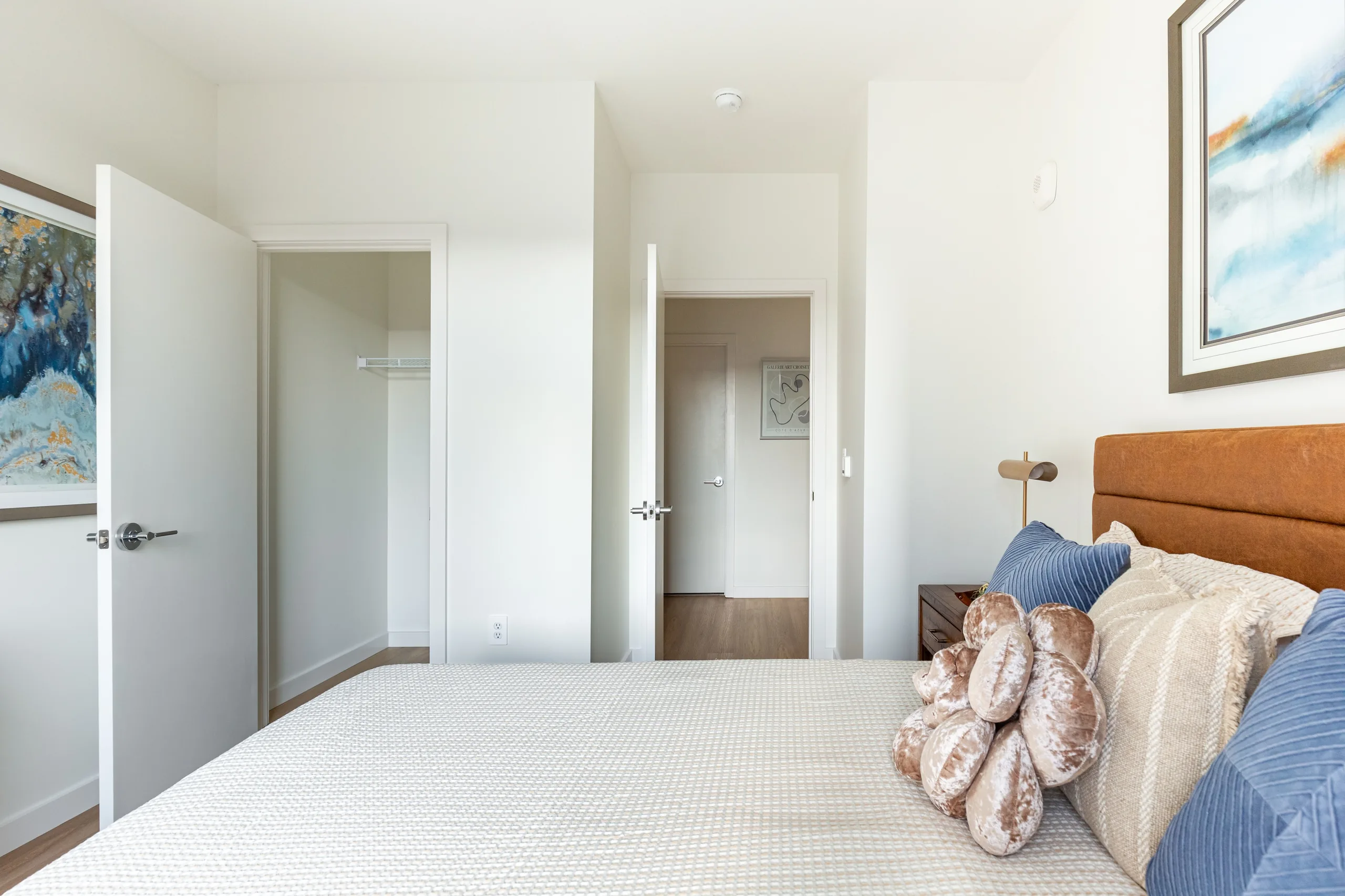 Bedroom with upholstered furnishings and adjoining interior spaces