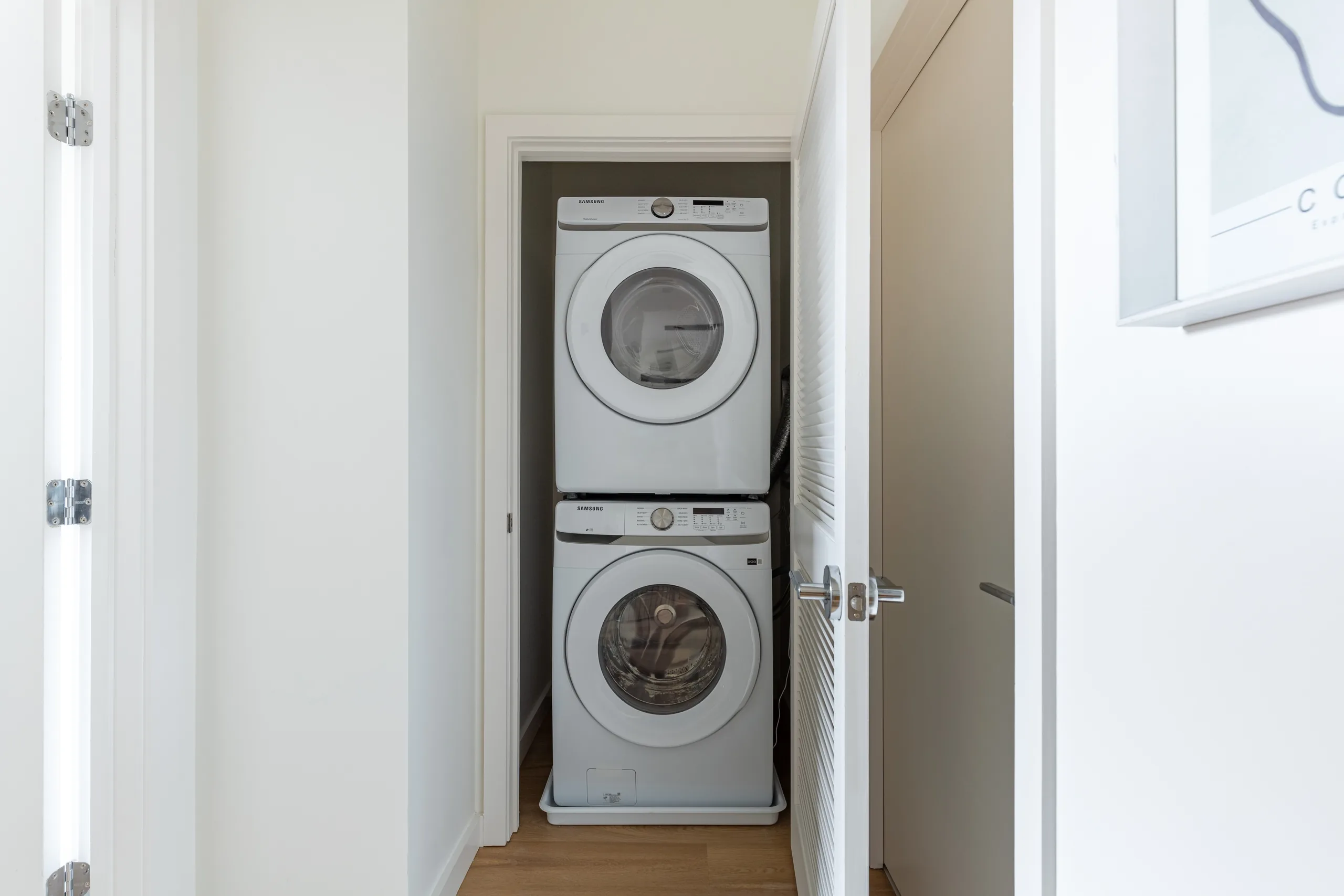 Stacked washer and dryer in a dedicated residence laundry closet
